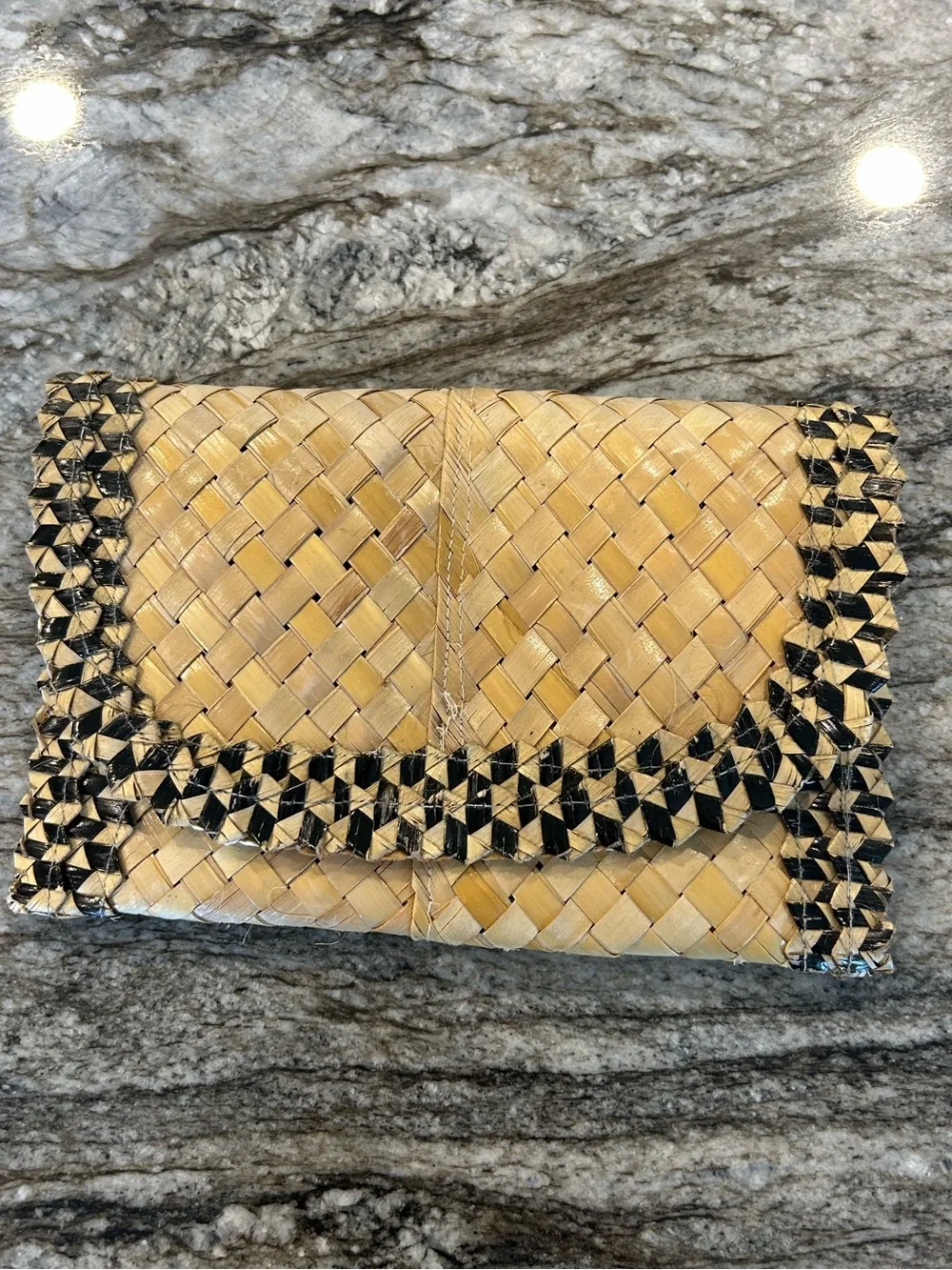 Handwoven Straw Clutch with Black Trim